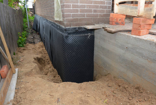 Happy homeowners after waterproofing job in Belgium